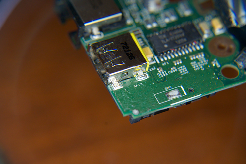 Photo showing front side of USB receptacle on motherboard PCB